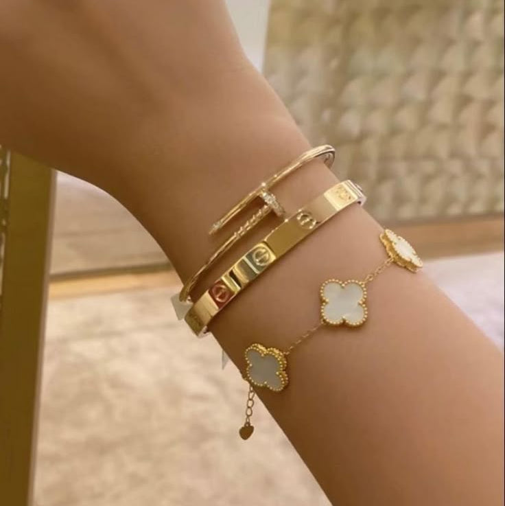 Gold plated bracelets featuring clover charm and nail design, hypoallergenic anti tarnish jewelry