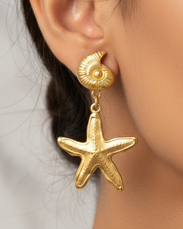 Held by Tides Earrings - Starfish-inspired gold earrings. Lightweight, water-resistant & glows on all skin tones.