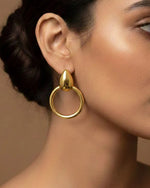 Load image into Gallery viewer, Rise Above You Earrings - Fluid drop gold earrings. Water-resistant, anti-tarnish for confident, everyday elevation.
